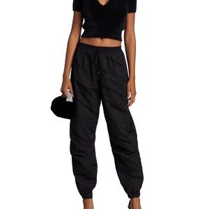 Alexander Wang allover flocked logo track pants